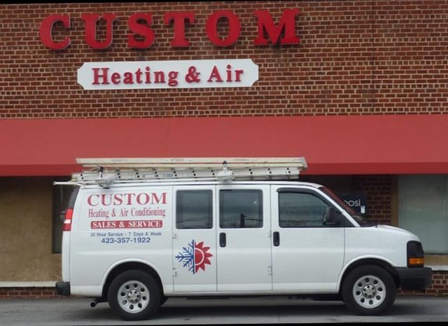 Custom Heating & Air Conditioning van outside the Church Hill shop